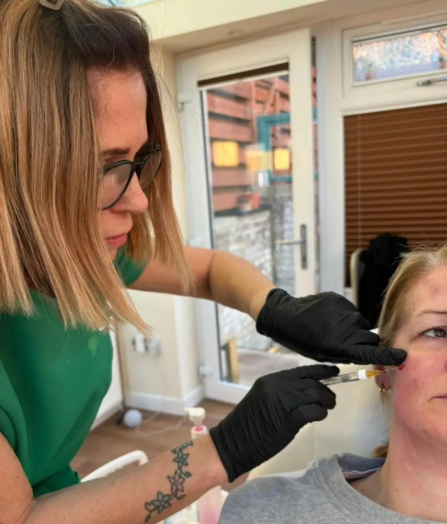 Fiona Russell performing a cheek filler treatment at AF13 Aesthetics